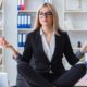 a young woman meditating in the office