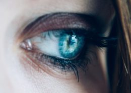 close up of a woman's blue eye