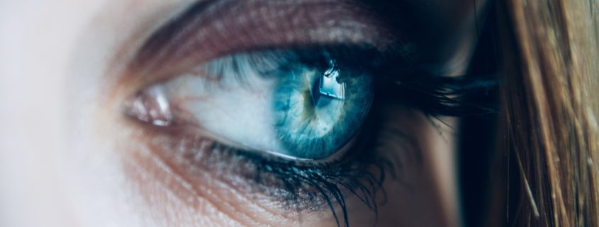 close up of a woman's blue eye