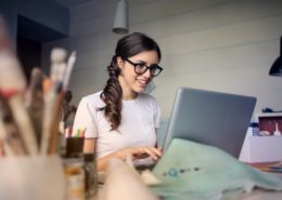 motivated woman in glasses sitting to do work