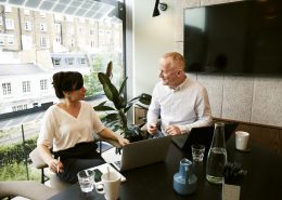 a man and a woman having conversation in the office