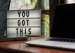 a letter board on the desk with an inspirational message