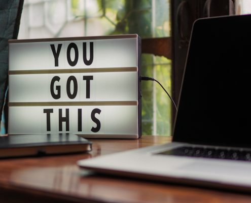 a letter board on the desk with an inspirational message