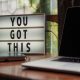 a letter board on the desk with an inspirational message